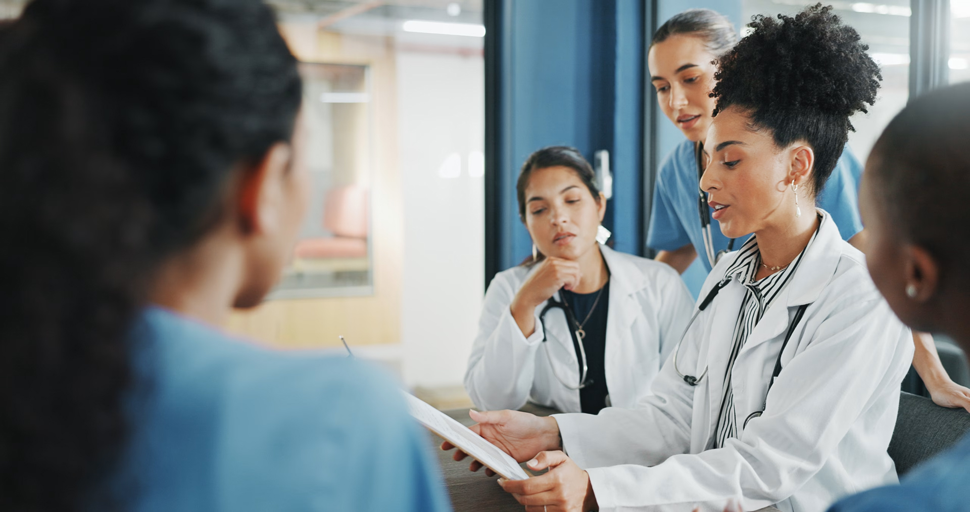 Providers at a hospital trying a demo of our revenue cycle solution with AI-powered features at Onpoint Healthcare Partners in Texas United States of America
